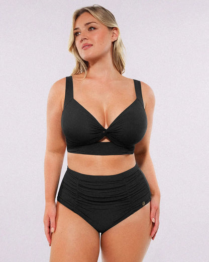 Model wearing twist-front black bikini set with high-waisted tummy control bottoms