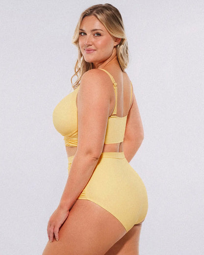 Side view of two-piece swimsuit highlighting waist shaping and smooth fit